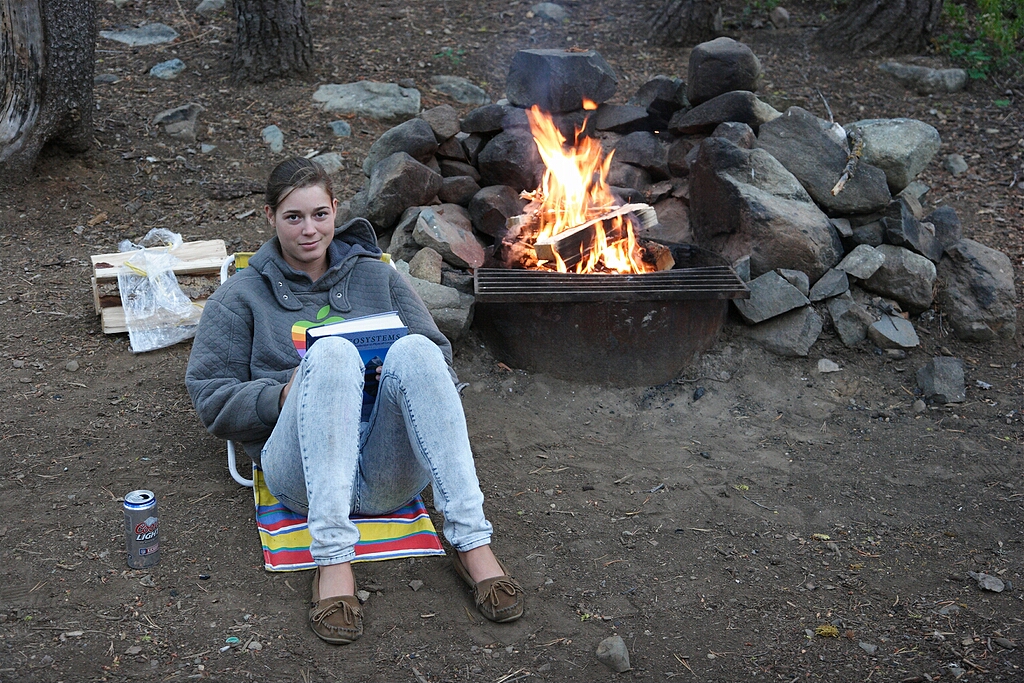 Our first evening at the campsite.  Sarah reads an interesting Geography textbook she found among my things.