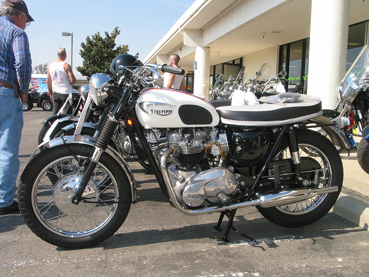 This is a 1966 T120 Bonneville.  My second Bonneville was this same year, but it was a TT special with the swept down pipes and minimal (ET System) electrics.  My brother still rides it.