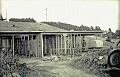 The carport is shown in its original configuration here.  When we got two cars, the posts supporting its roof were moved farther from the house to accomodate parking both cars.